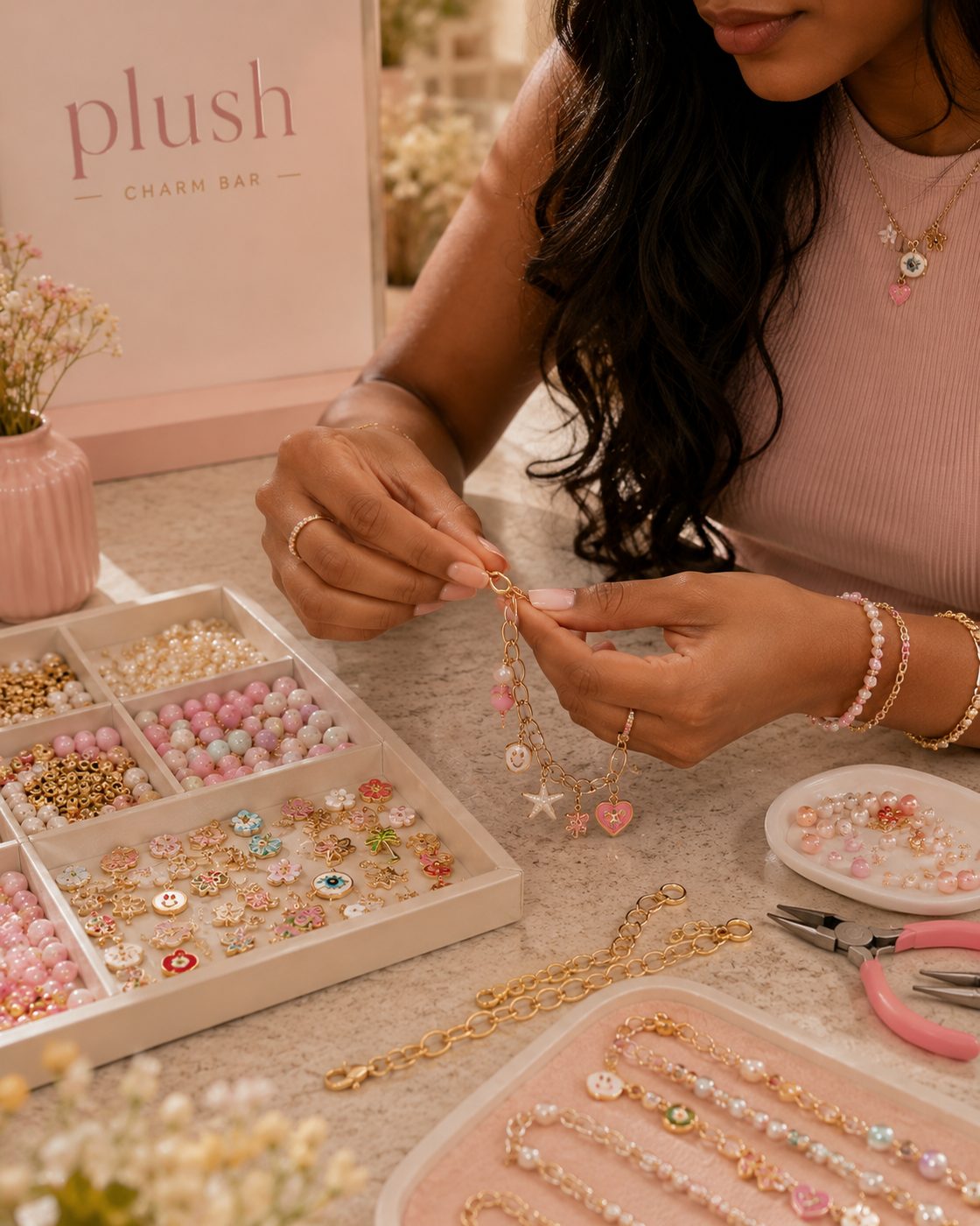 Girl choosing charms at Plush Charm Bar