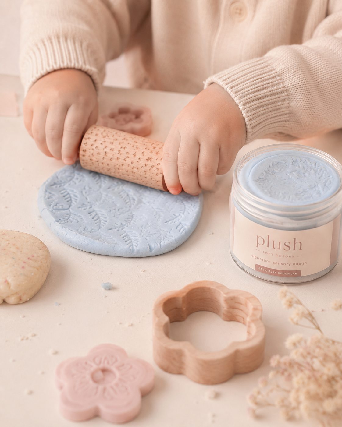 Older girl and young girl with Plush charm and dough